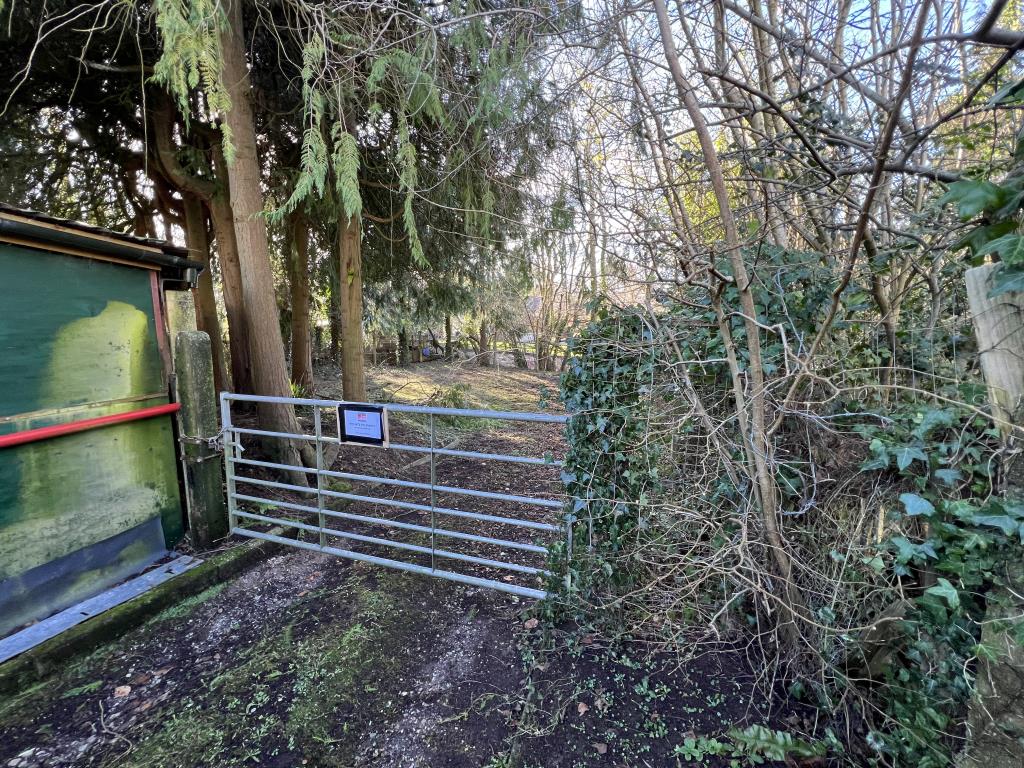 Lot: 3 - AREA OF LAND WITH ACCESS TRACK IN VILLAGE LOCATION WITH POTENTIAL - View of the gate access